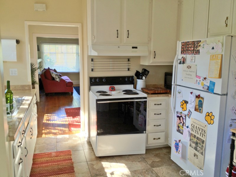 308 Coronado Avenue Long Beach, CA 90814 - Photo 7 of 10 a kitchen with a stove and white cabinets