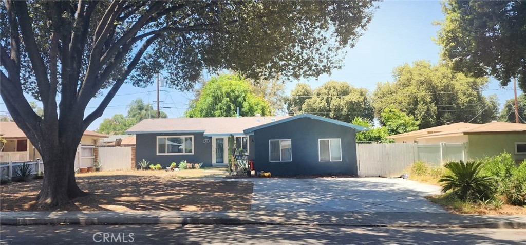 3016 Miguel Street Riverside, CA 92506 - Photo 1 of 1 a front view of a house with a garden
