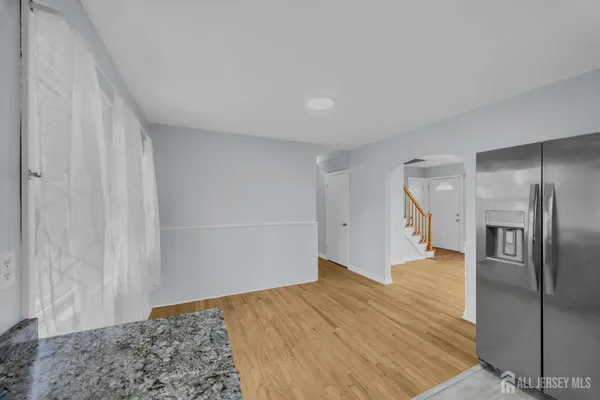 a view of a room with a wooden floor