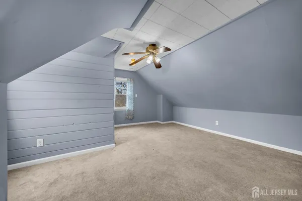a bathroom with a sink toilet vanity and bathtub