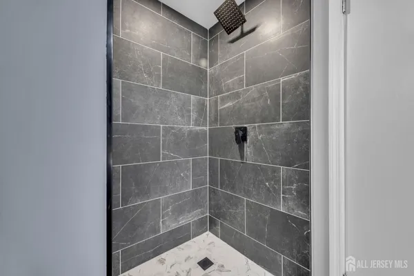 a view of an empty room with gym equipment