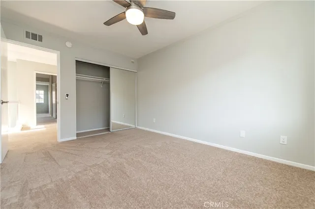 an empty room with fan