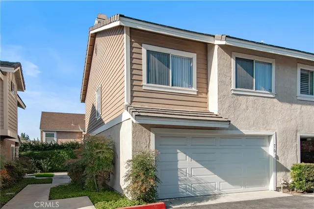 a front view of a house with garage