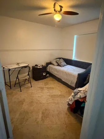a bed room with a bed and furniture
