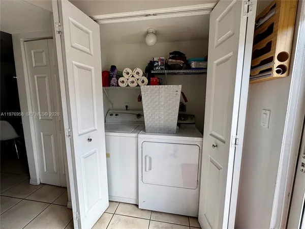 a storage room with washer and dryer