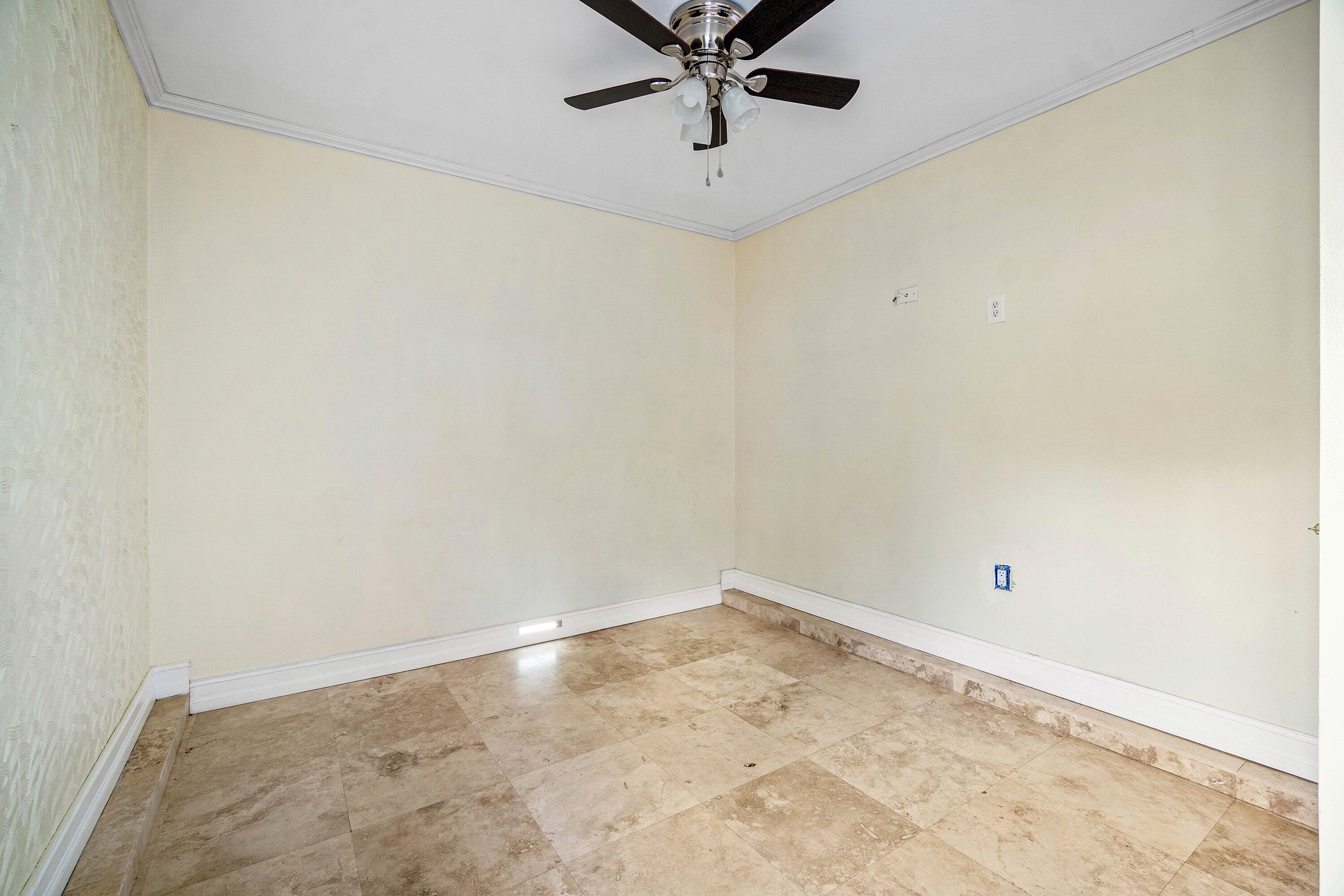 8411 Garden Gate Place Boca Raton, FL 33433 - Photo 11 of 12 a view of a room with a ceiling fan