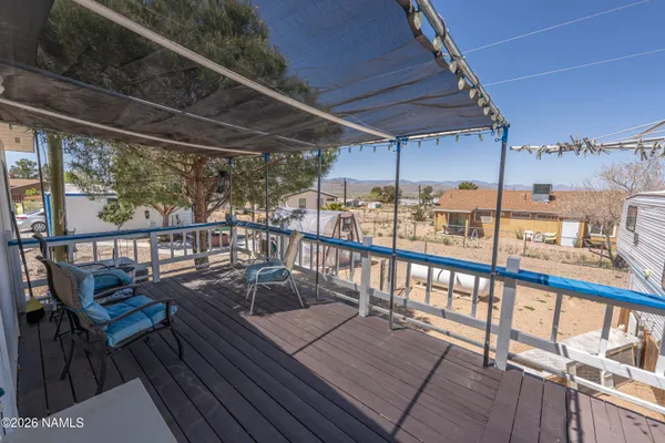 a view of a balcony with chairs