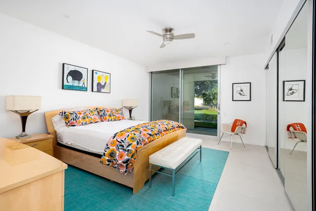 a bedroom with a bed and a couch