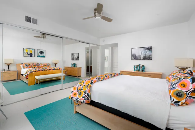 a bedroom with bed and window