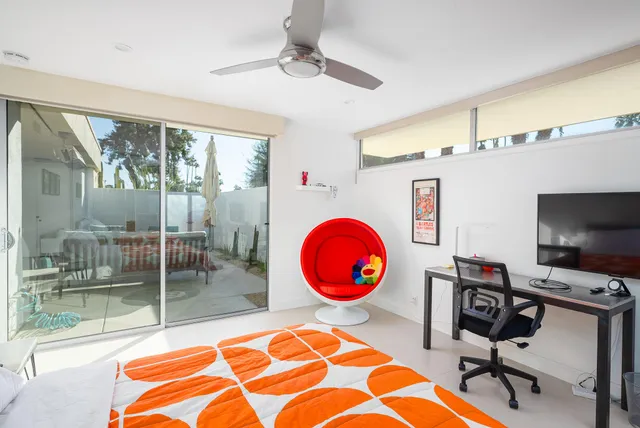 a swimming pool with a table and chairs