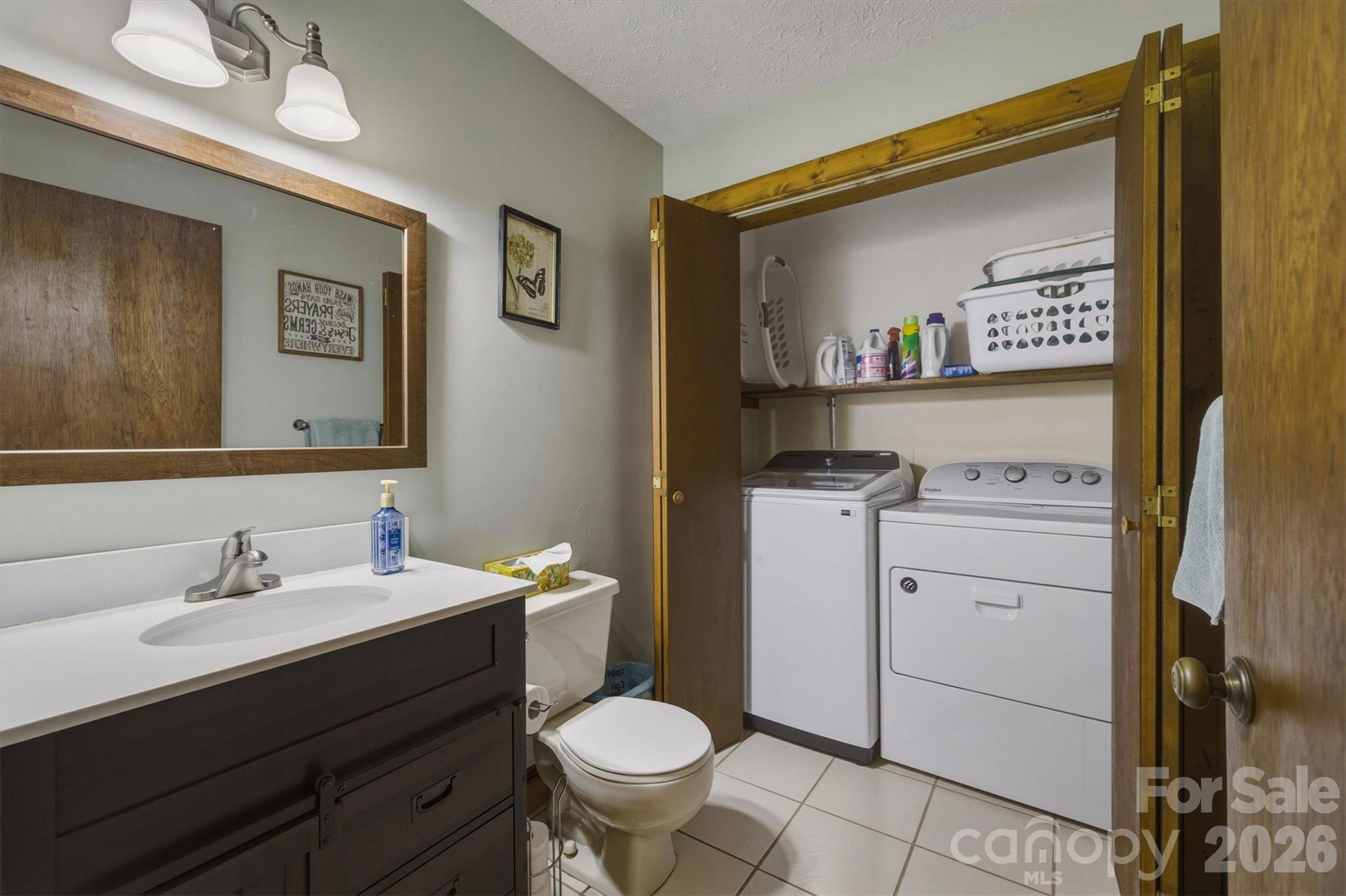 3432 Ridgewood Drive Morganton, NC 28655 - Photo 15 of 36 a bathroom with a sink toilet and a mirror