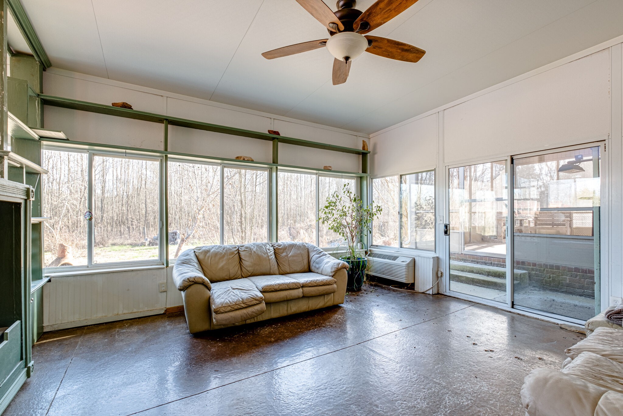 576 Swamp Road Eagleville, TN 37060 - Photo 12 of 27 a living room with furniture and a floor to ceiling window