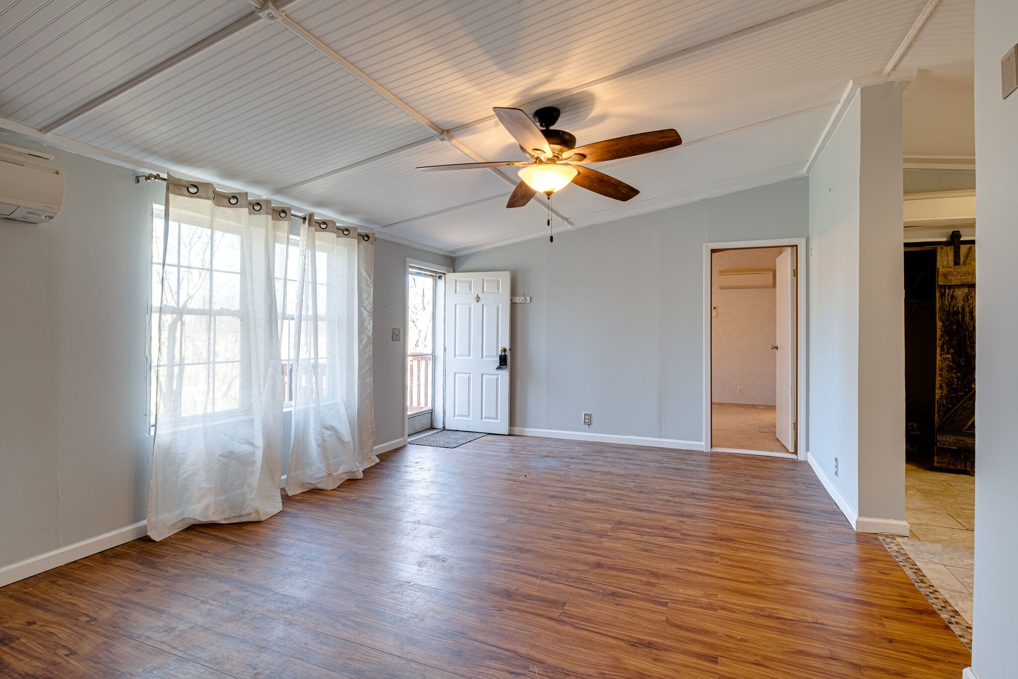 576 Swamp Road Eagleville, TN 37060 - Photo 4 of 27 a view of an empty room with window and wooden floor