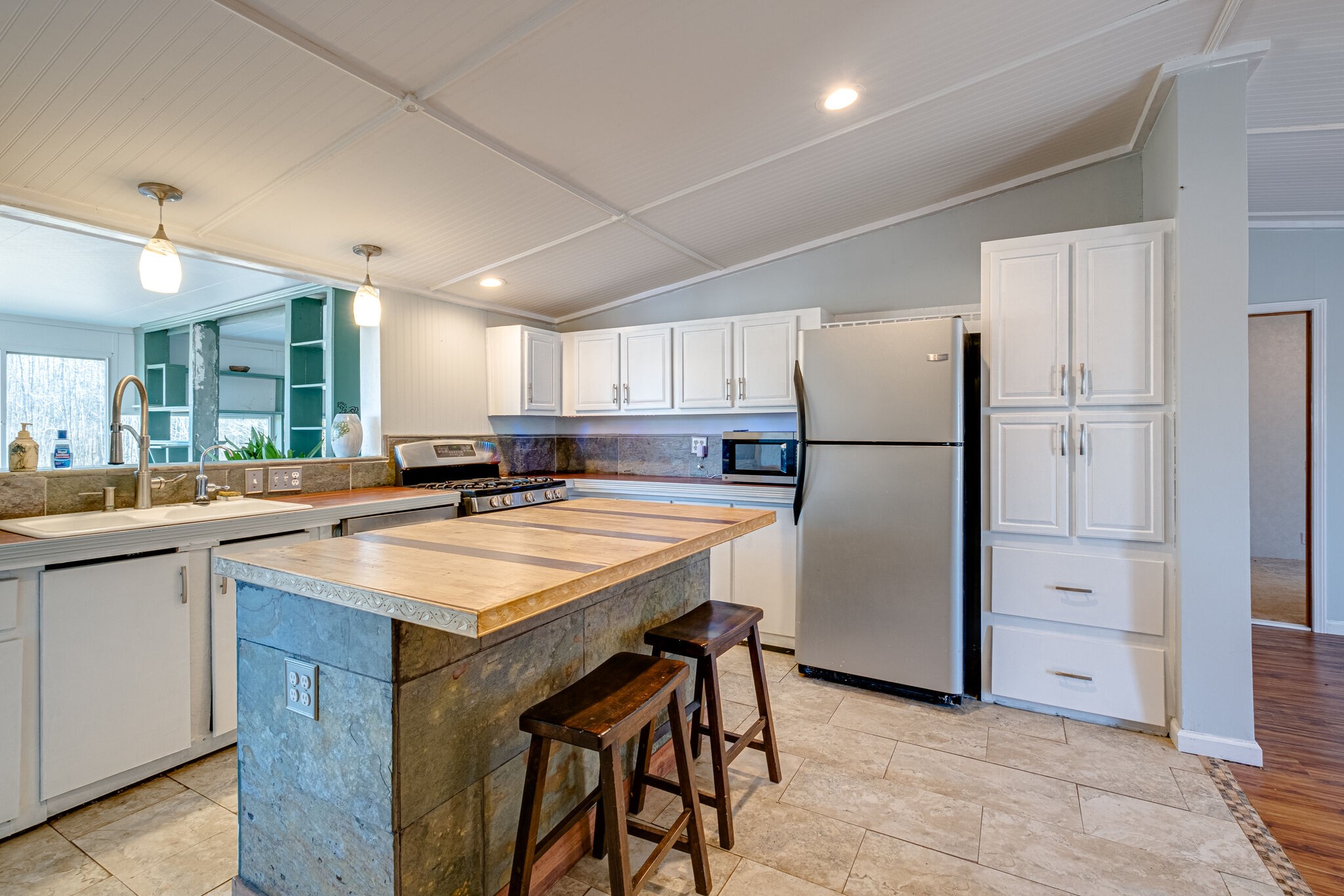 576 Swamp Road Eagleville, TN 37060 - Photo 8 of 27 a kitchen with refrigerator and cabinets