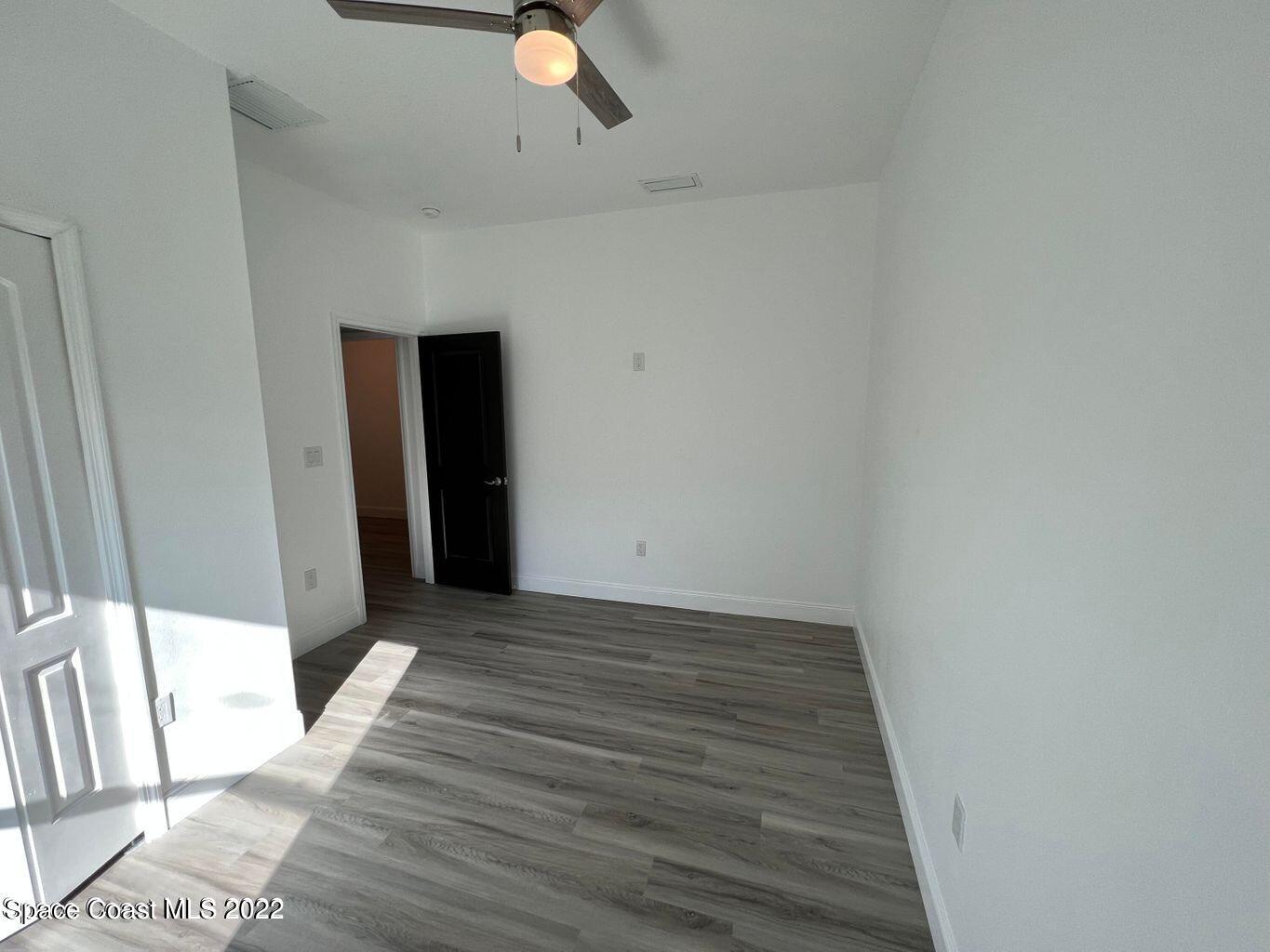 2498 Mitchell Avenue Mims, FL 32754 - Photo 13 of 18 a view of a livingroom with wooden floor