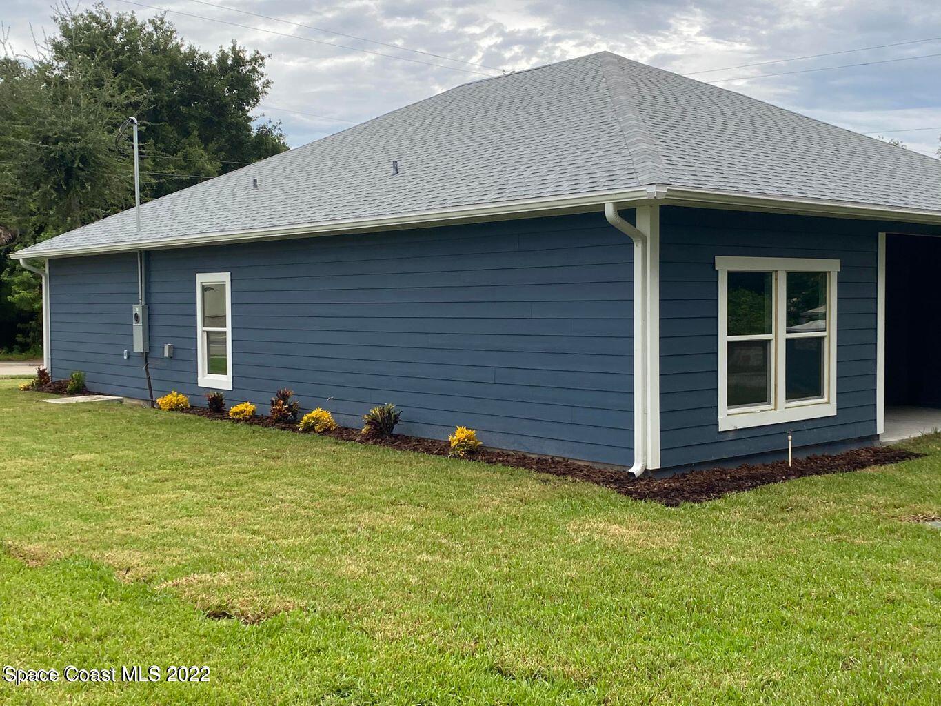 2498 Mitchell Avenue Mims, FL 32754 - Photo 17 of 18 a view of a house with backyard