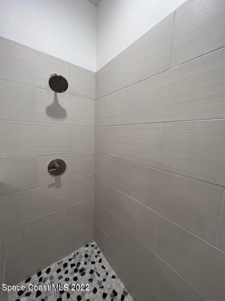 2498 Mitchell Avenue Mims, FL 32754 - Photo 9 of 18 a bathroom with a shower