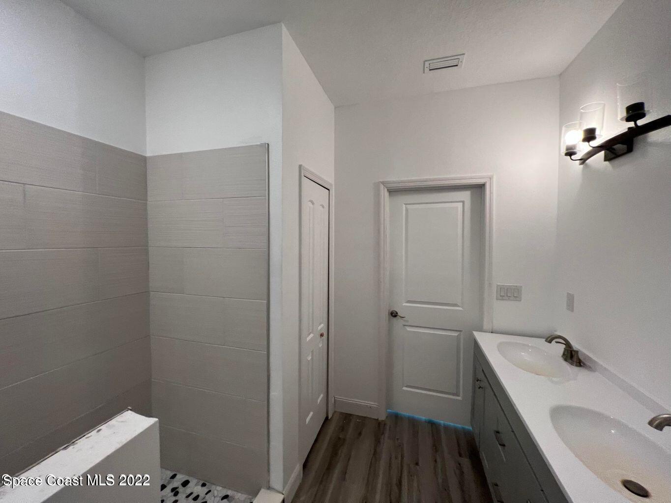 2498 Mitchell Avenue Mims, FL 32754 - Photo 10 of 18 a bathroom with a sink a toilet and shower