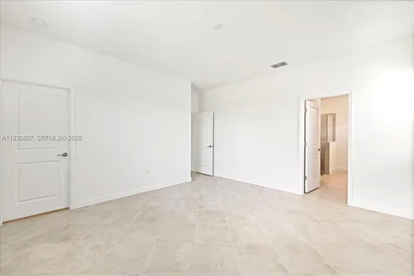 a bathroom with a double vanity sink and mirror