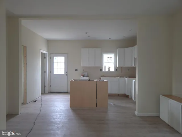 a view of entryway with wooden floor and stairs