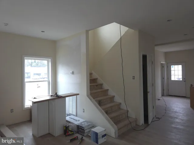 a view of a room with gym equipment and windows