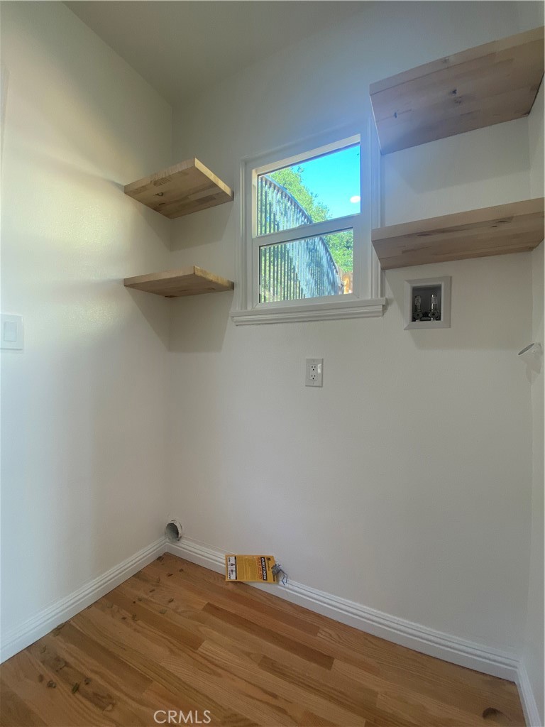 775 Morada Place Altadena, CA 91001 - Photo 18 of 32 a room with a wooden floor and a window