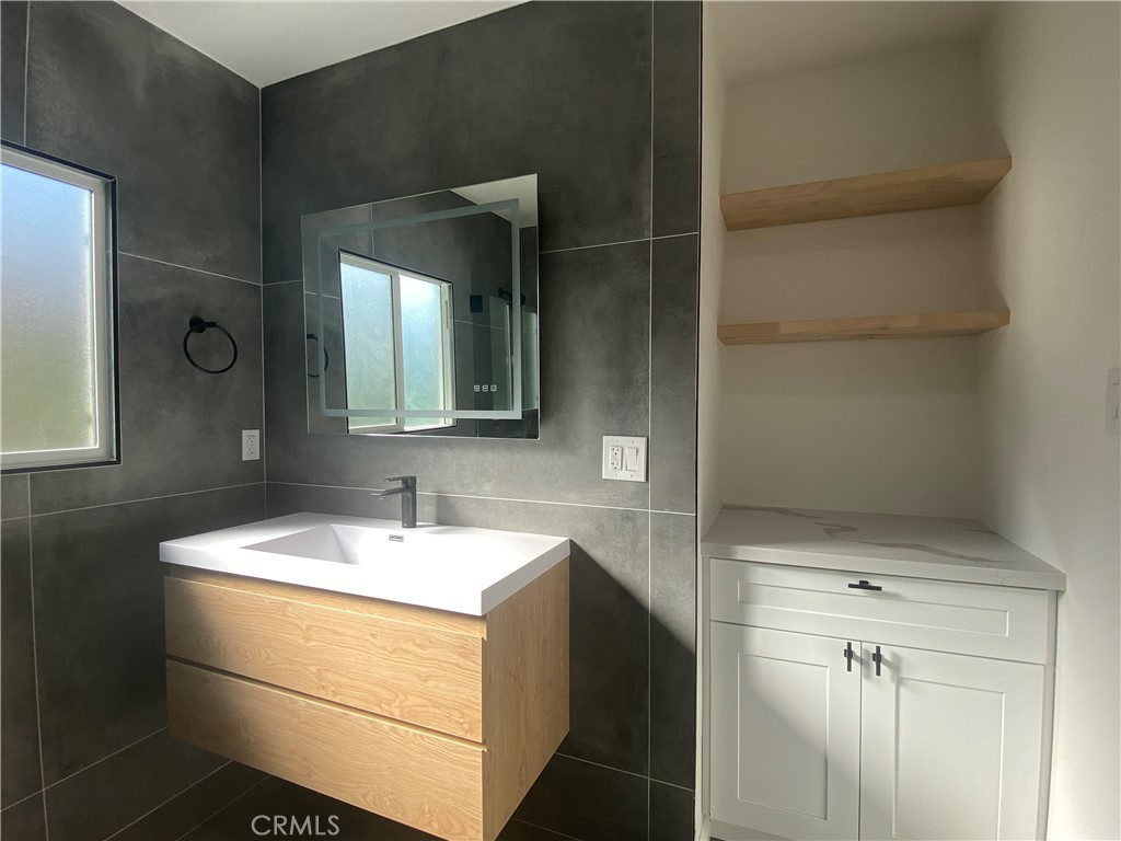 775 Morada Place Altadena, CA 91001 - Photo 22 of 32 a bathroom with a sink and a mirror