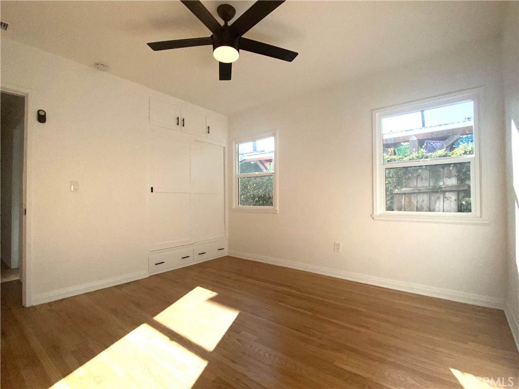 775 Morada Place Altadena, CA 91001 - Photo 25 of 32 a view of an empty room with wooden floor and a window