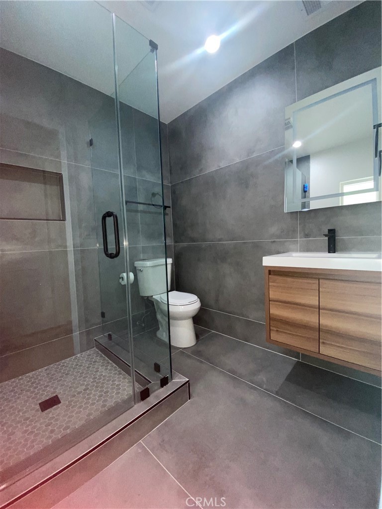 775 Morada Place Altadena, CA 91001 - Photo 26 of 32 a bathroom with a sink toilet and shower