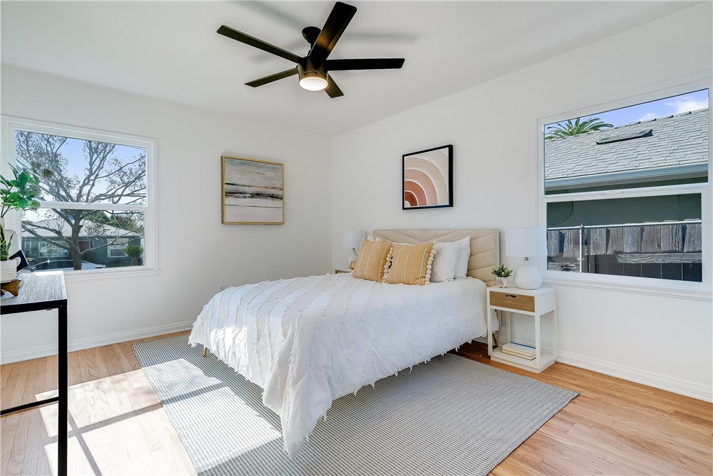 775 Morada Place Altadena, CA 91001 - Photo 9 of 32 a bedroom with a bed and a painting on the wall