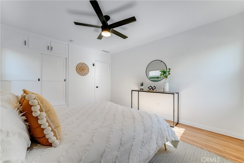 775 Morada Place Altadena, CA 91001 - Photo 10 of 32 a bedroom with a bed and a chandelier