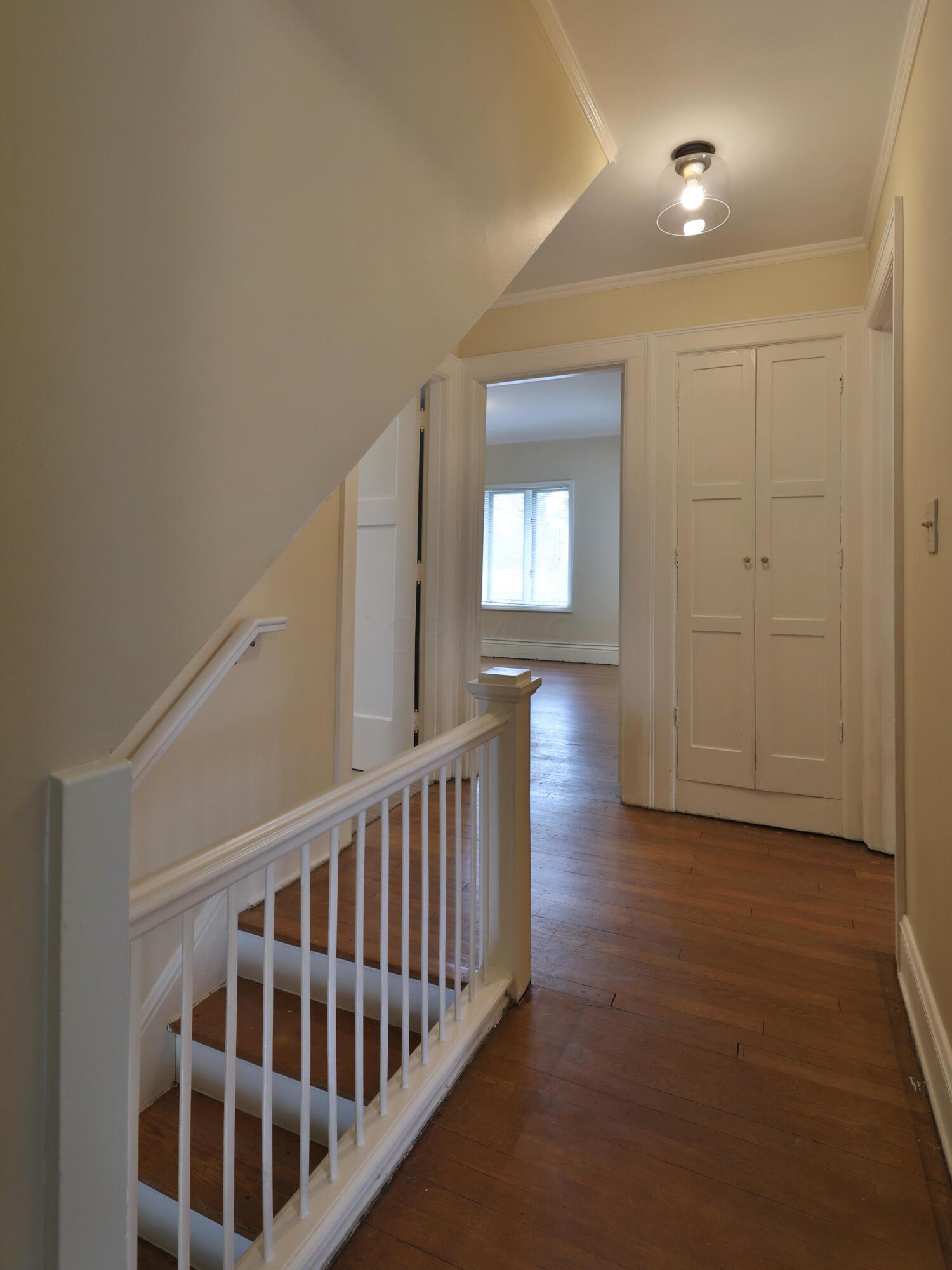 2180 Bryden Road Columbus, OH 43209 - Photo 29 of 56 Original hardwood flooring throughout. New hall lighting.