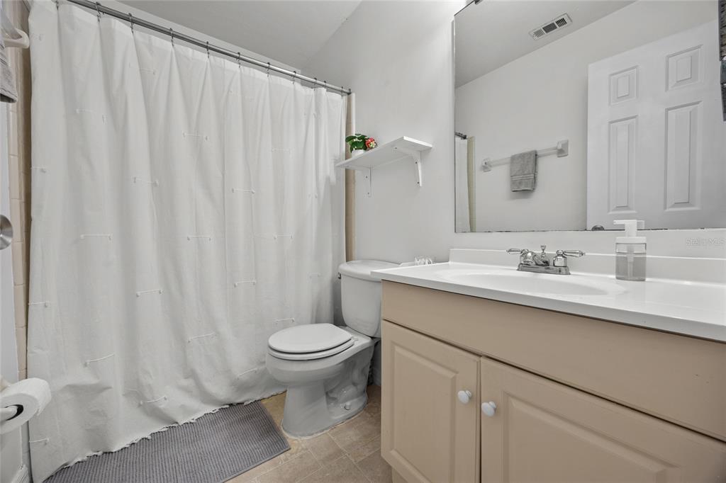 5733 Southwest 10th Place Gainesville, FL 32607 - Photo 15 of 23 a bathroom with a sink toilet and shower