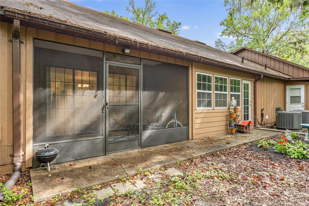 5733 Southwest 10th Place Gainesville, FL 32607 - Photo 21 of 23 a view of a house with a patio