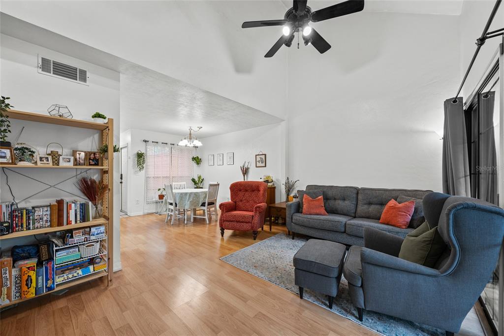 5733 Southwest 10th Place Gainesville, FL 32607 - Photo 4 of 23 a living room with furniture and a book shelf