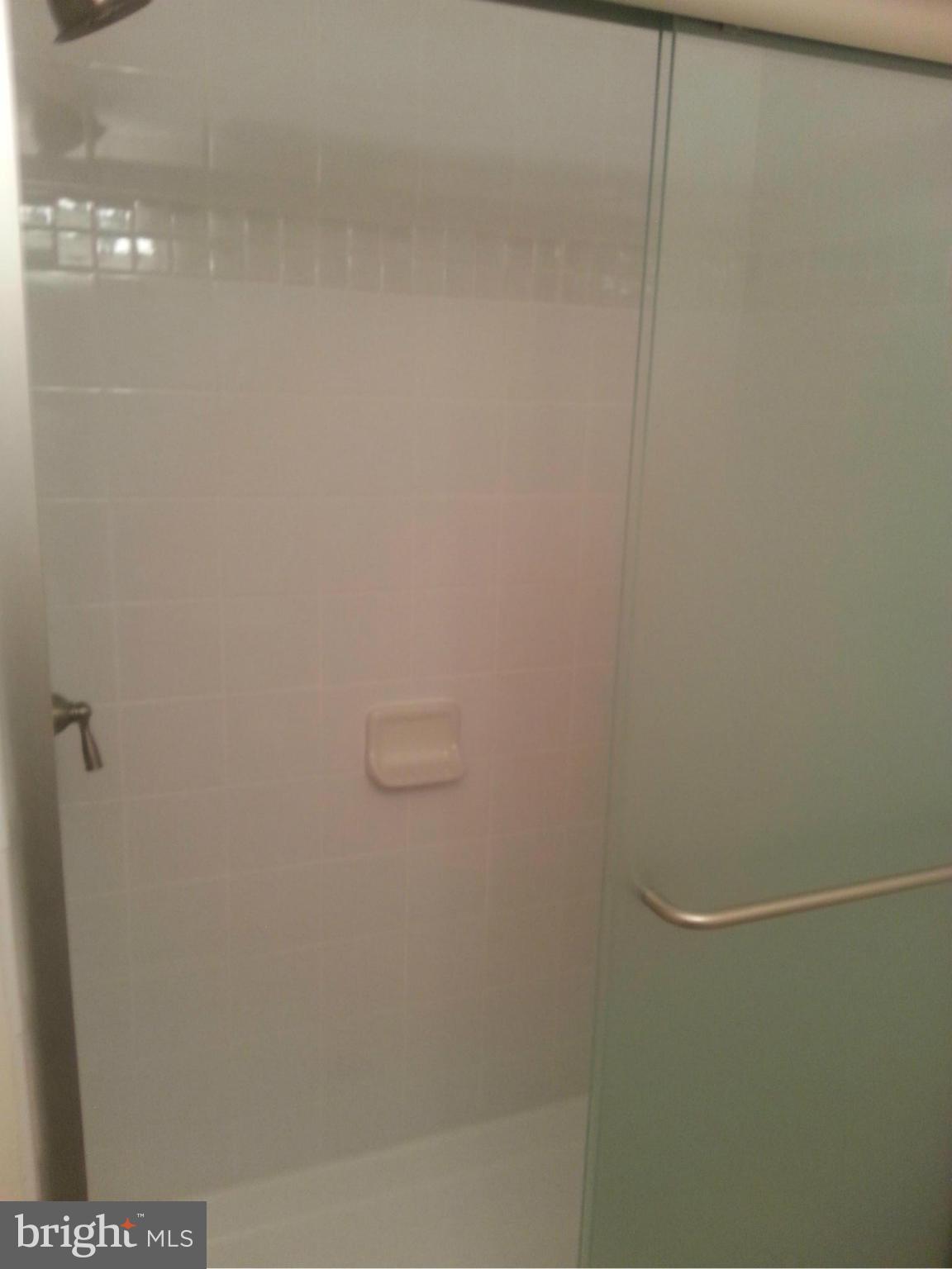 11627 Stoneview Square, Unit 21C Reston, VA 20191 - Photo 2 of 19 a bathroom with a shower