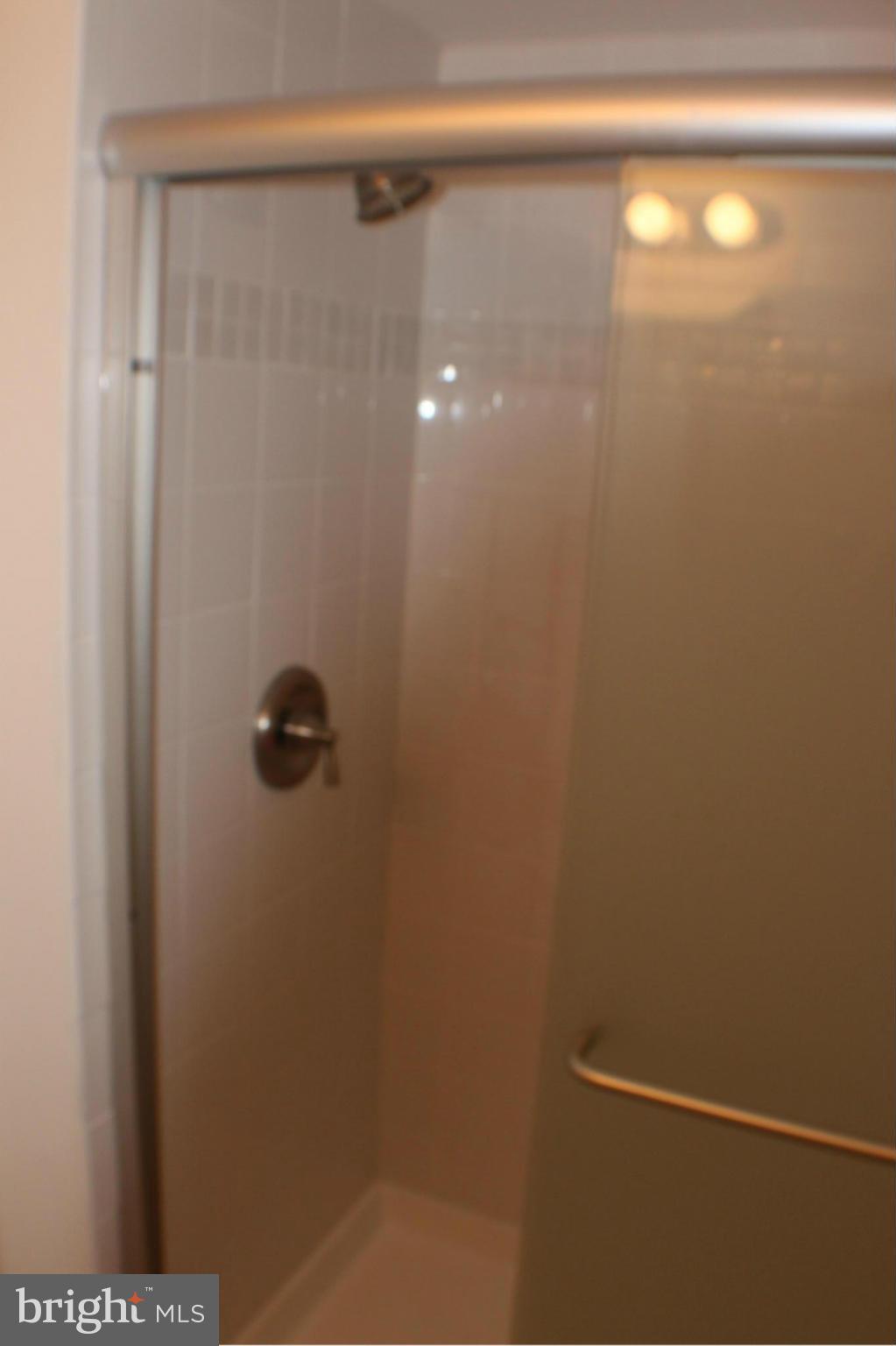 11627 Stoneview Square, Unit 21C Reston, VA 20191 - Photo 19 of 19 a bathroom with a shower