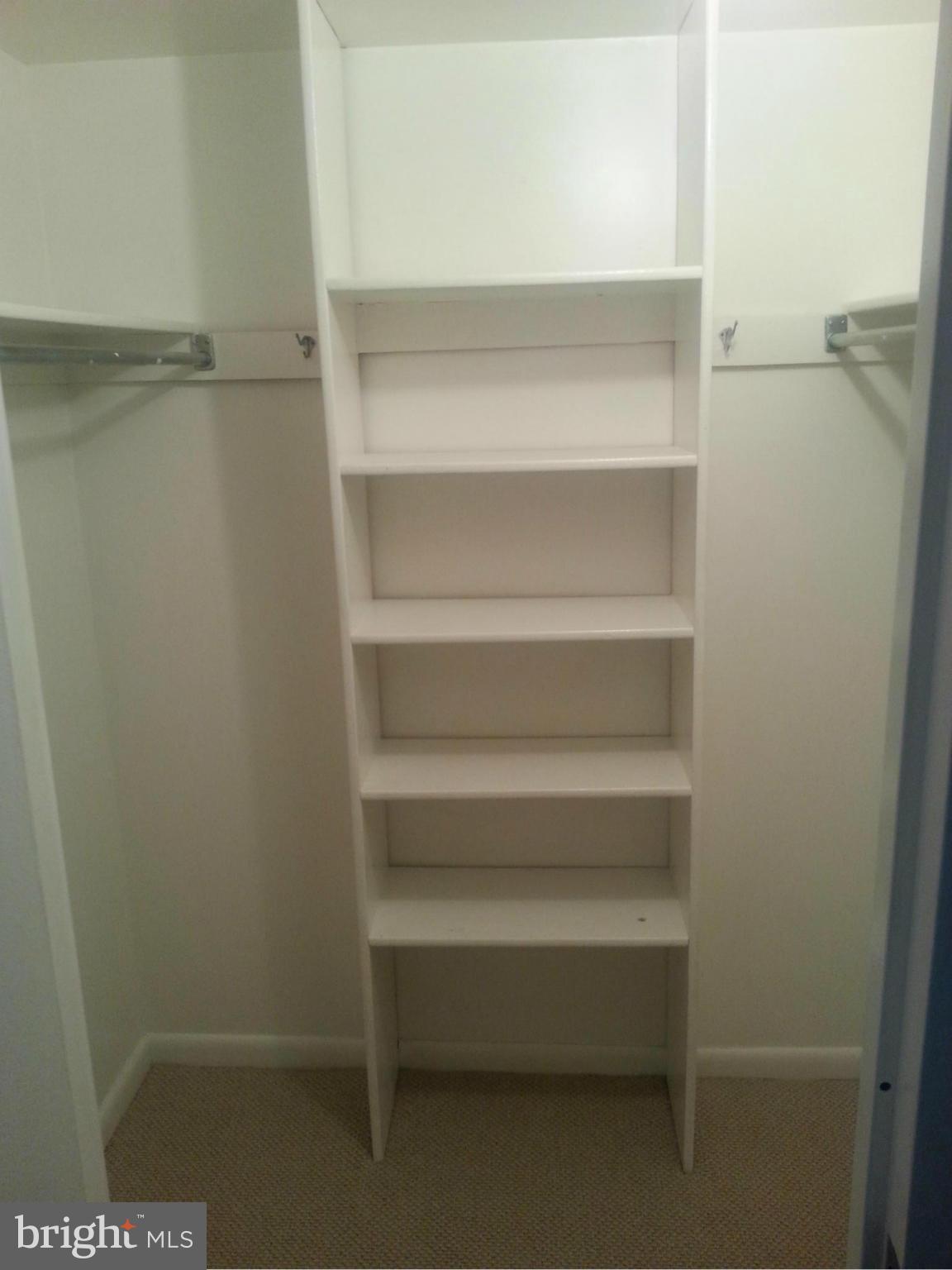 11627 Stoneview Square, Unit 21C Reston, VA 20191 - Photo 4 of 19 a view of an empty walk in closet