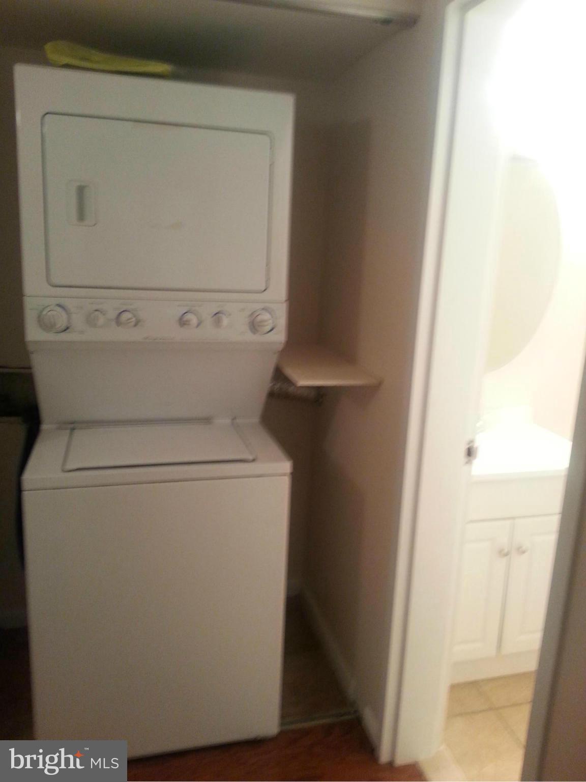 11627 Stoneview Square, Unit 21C Reston, VA 20191 - Photo 5 of 19 a close up view of washer and dryer