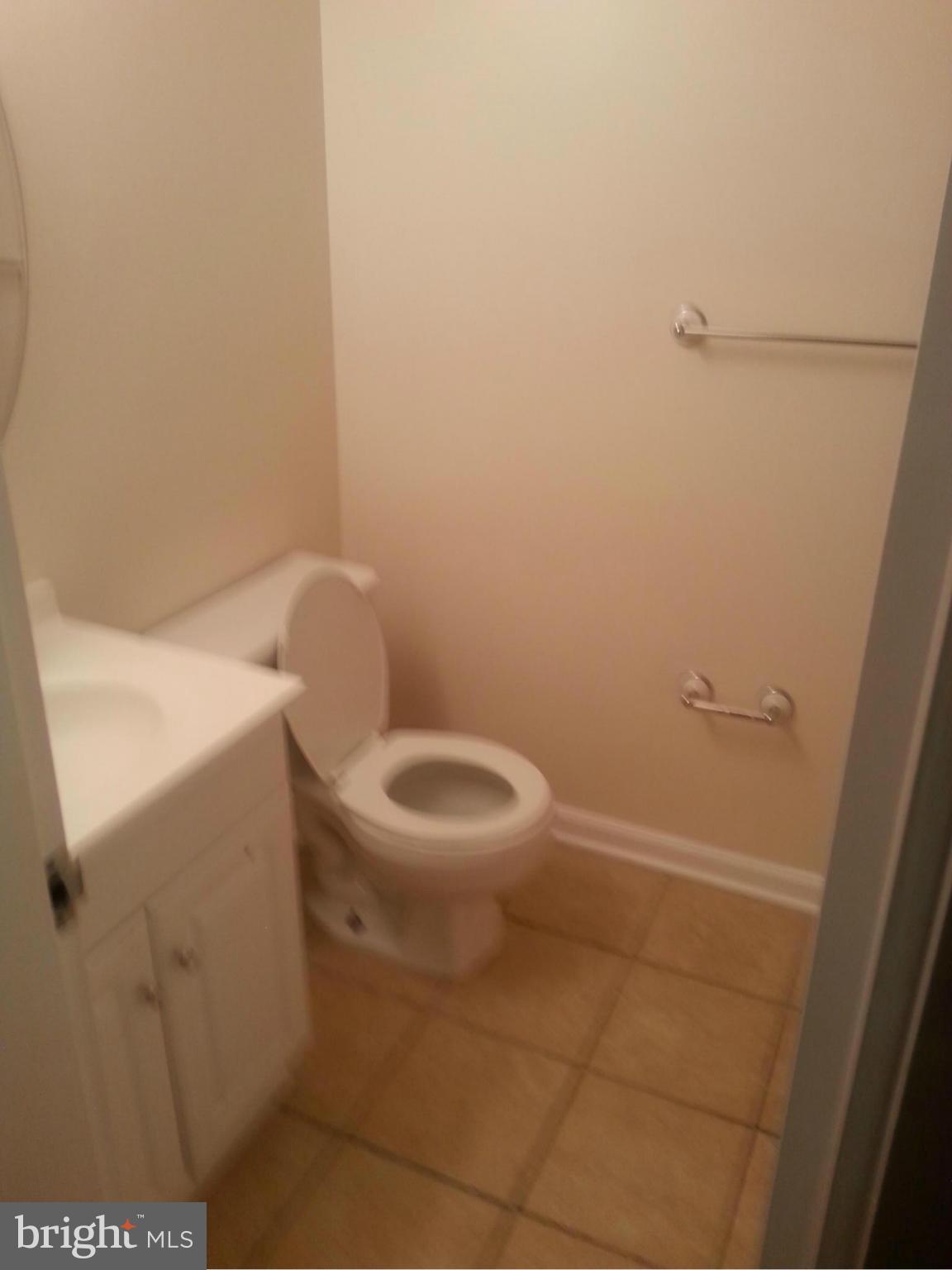 11627 Stoneview Square, Unit 21C Reston, VA 20191 - Photo 6 of 19 a white toilet sitting next to a white sink