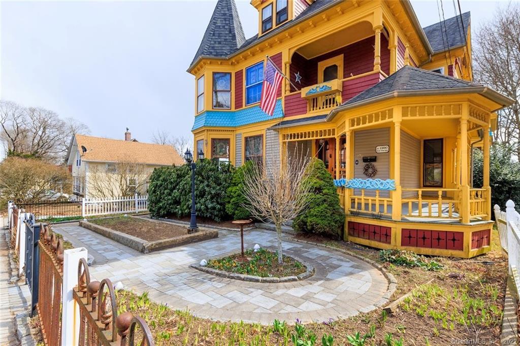When Spring and Summer arrive you could see a beautiful English Garden here. From history, the yellow home in the distance was the original house on the 3 parcel lot. Some of the fencing is early. The door to the right goes to the dining room.