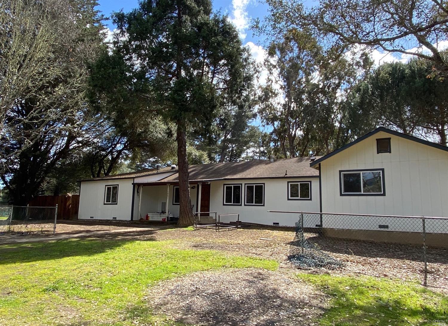 18031 Blattner Road Philo, CA 95466 - Photo 1 of 1 a front view of a house with swimming pool