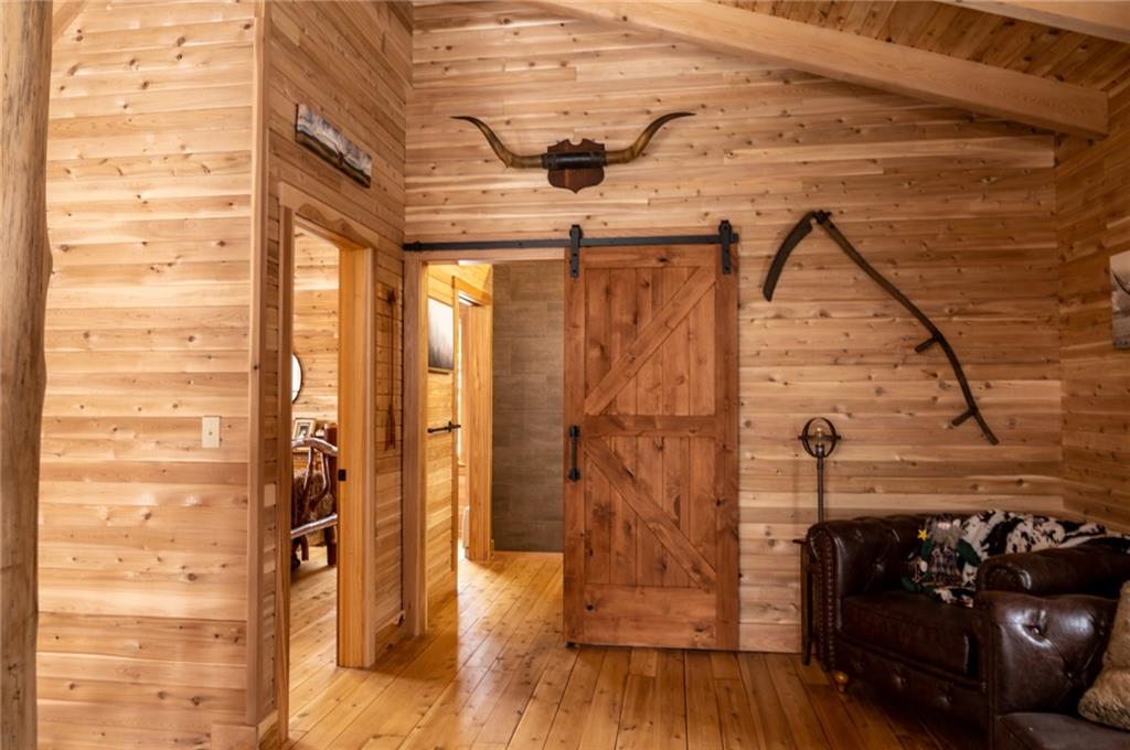 8498 East Lake Road Erie, PA 16511 - Photo 16 of 16 a bedroom with a bed and wooden floor