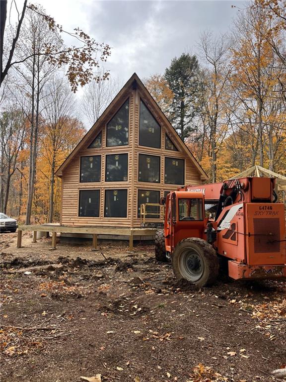 8498 East Lake Road Erie, PA 16511 - Photo 3 of 16 a view of a house with truck parked on the road