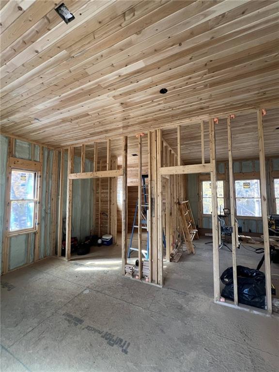 8498 East Lake Road Erie, PA 16511 - Photo 9 of 16 an empty room with wooden floor and windows