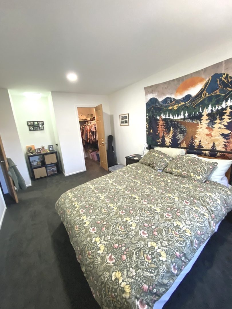 654 Inverrary Lane Deerfield, IL 60015 - Photo 16 of 30 a bed sitting in a bedroom next to a window