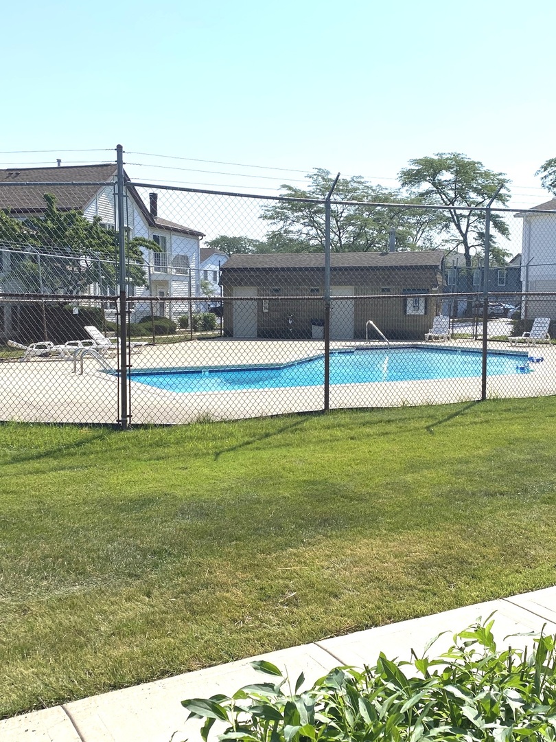 654 Inverrary Lane Deerfield, IL 60015 - Photo 30 of 30 a view of a swimming pool with a yard