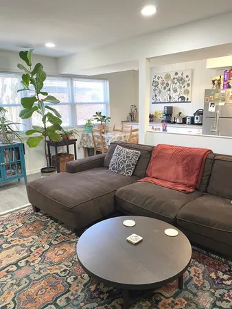 a living room with furniture and a swimming pool