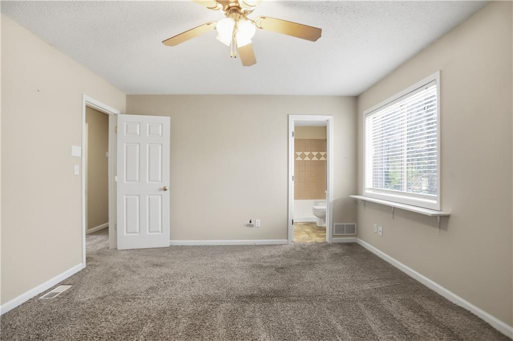 4899 Hawk Trail Marietta, GA 30066 - Photo 20 of 35 a view of an empty room with a window