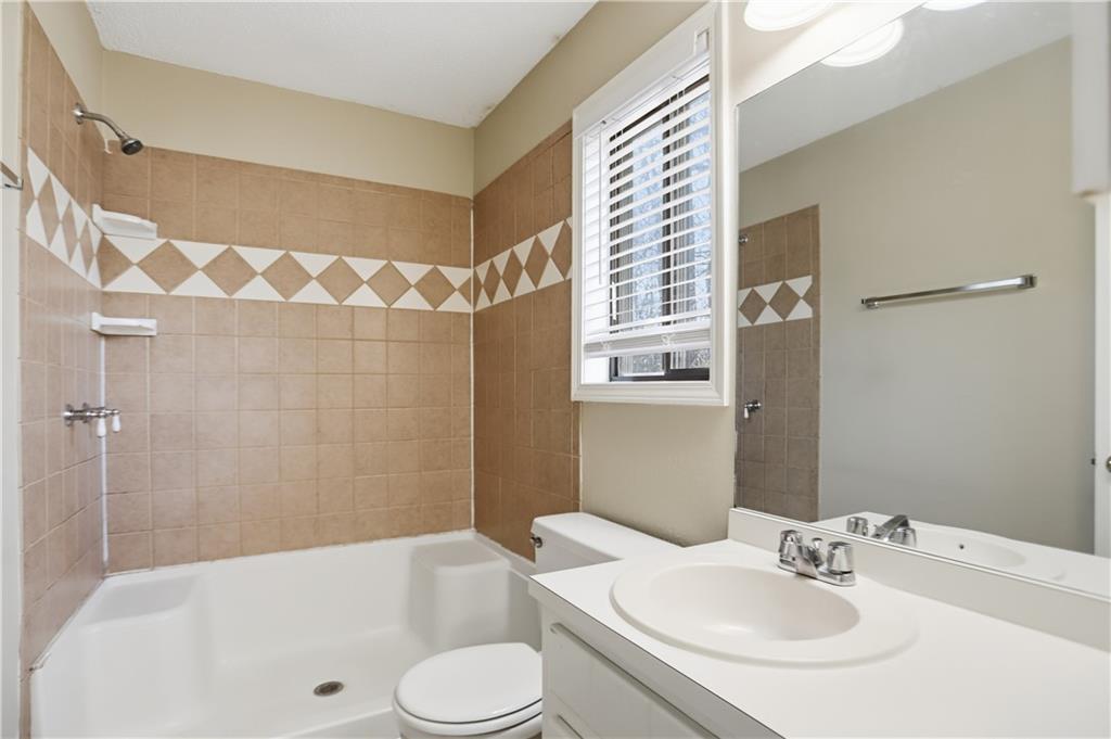 4899 Hawk Trail Marietta, GA 30066 - Photo 22 of 35 a bathroom with a sink toilet and shower